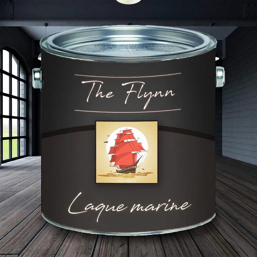 Pot de peinture The Flynn Bootslack gris foncé avec un navire à voiles rouges, sur un parquet en bois.