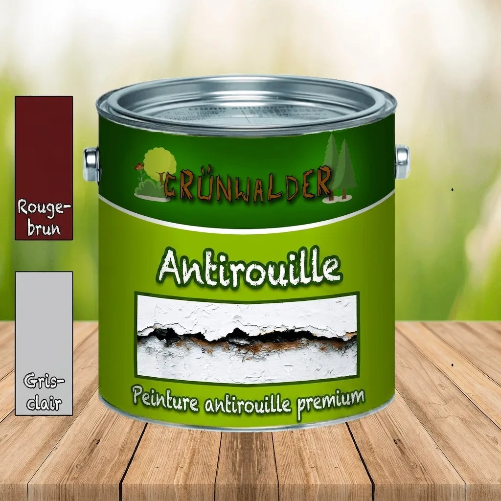 Pot de peinture antirouille Grünwalder vert avec échantillons rouge-brun et gris clair, sur table en bois.